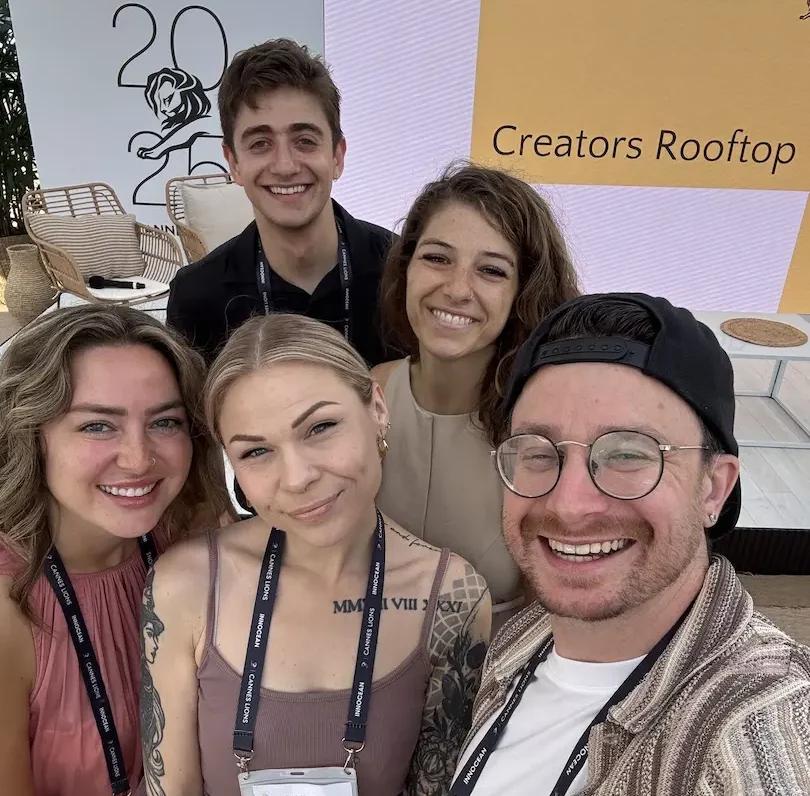 A group photo of Patrick, his Inclusify Studios team, and the ASL interpreter team on the Creators Rooftop at Cannes Lions.