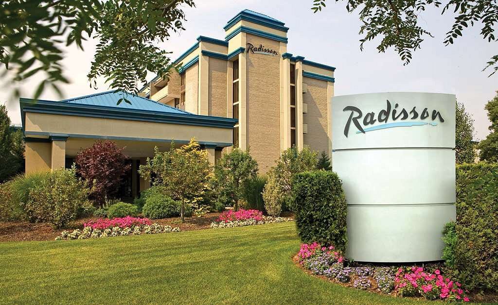 The Radisson Hotel Hauppauge-Long Island viewed from its landscaped entrance.