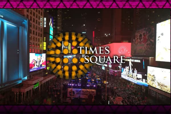 The livestream title card as it appeared to remote viewers: an aerial shot of the packed Times Square crowd behind the words 'Times Square' and the Alliance's yellow starburst mark.