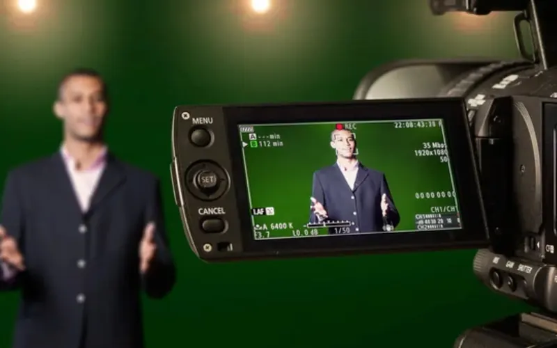 A signer recording an ASL translation in a video studio